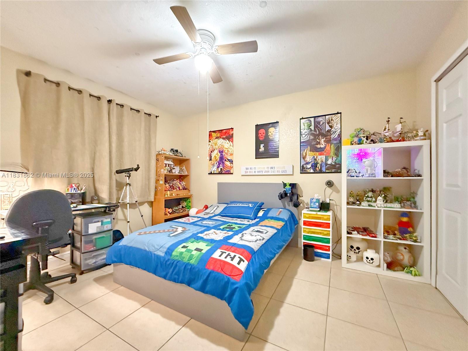 21150 Southwest 87th Avenue, Unit 105 Cutler Bay, FL 33189 - Photo 23 of 31 a bedroom with a bed and a window