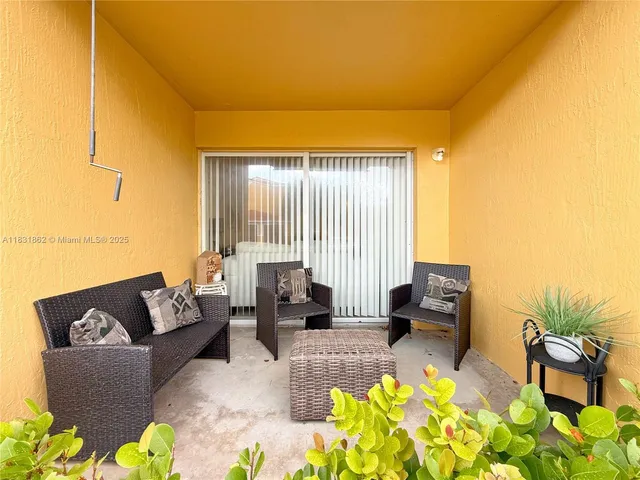 a living room with furniture and a couch