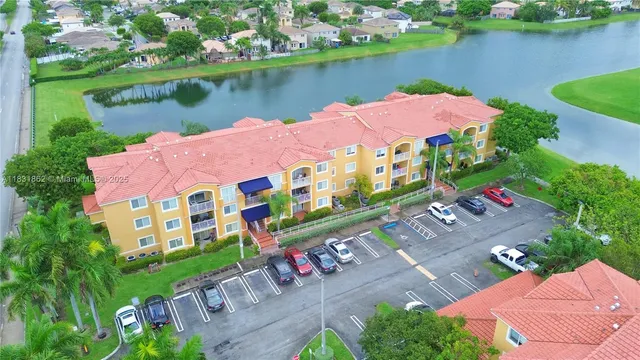 an aerial view of a house with a lake view