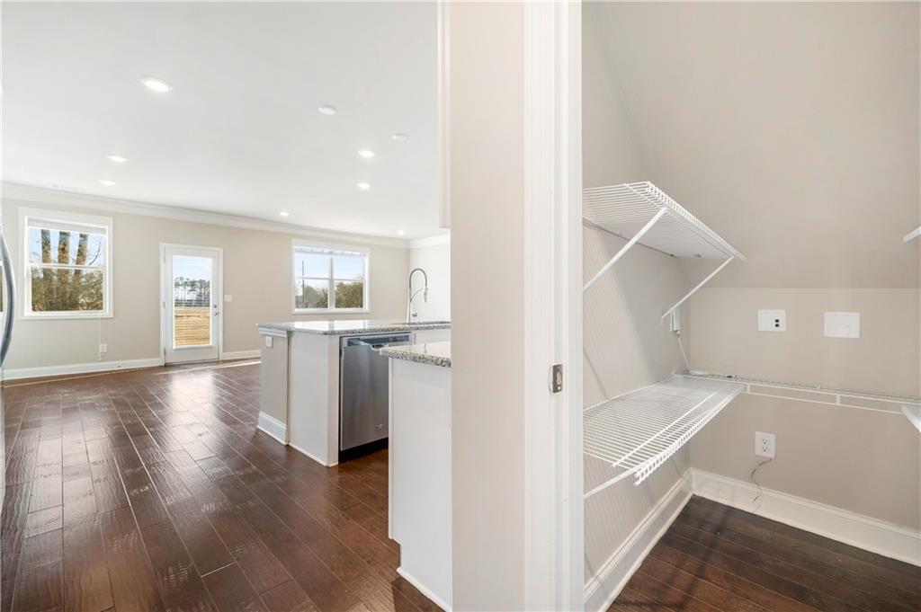 2747 Pearl Rdg Trace Buford, GA 30519 - Photo 14 of 41 a view of a kitchen and an entryway with wooden floor