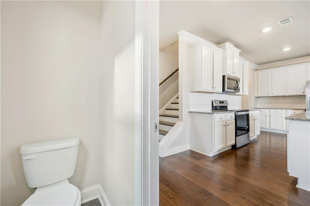2747 Pearl Rdg Trace Buford, GA 30519 - Photo 15 of 41 a kitchen with stainless steel appliances a refrigerator and stove top oven