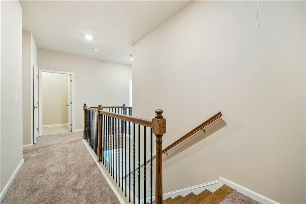 2747 Pearl Rdg Trace Buford, GA 30519 - Photo 17 of 41 a view of a hallway with wooden floor and entryway