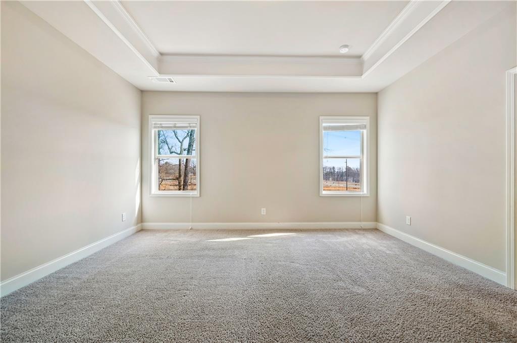 2747 Pearl Rdg Trace Buford, GA 30519 - Photo 18 of 41 an empty room with windows and closet