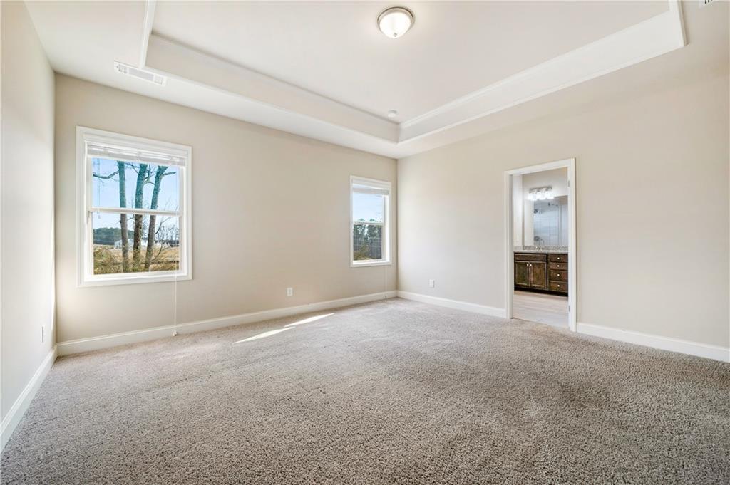 2747 Pearl Rdg Trace Buford, GA 30519 - Photo 20 of 41 an empty room with windows and closet