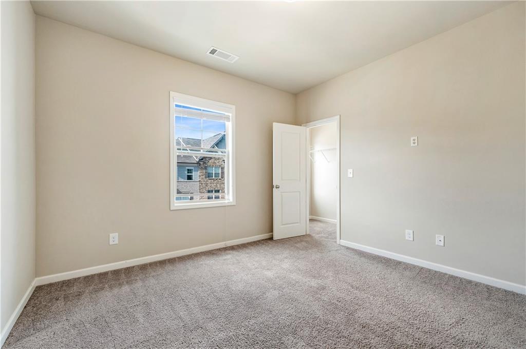 2747 Pearl Rdg Trace Buford, GA 30519 - Photo 26 of 41 a view of an empty room with a window