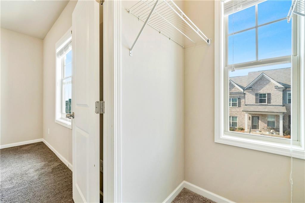 2747 Pearl Rdg Trace Buford, GA 30519 - Photo 28 of 41 a view of an entryway with wooden floor
