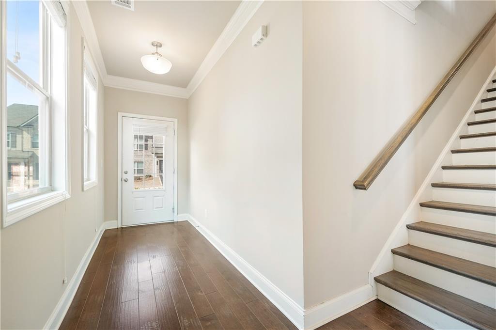 2747 Pearl Rdg Trace Buford, GA 30519 - Photo 3 of 41 a view of a hallway with wooden floor and entryway