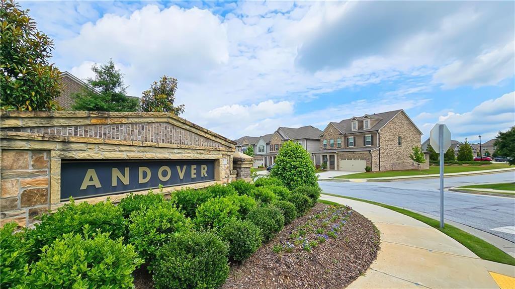 2747 Pearl Rdg Trace Buford, GA 30519 - Photo 39 of 41 a view of building with sign board and yard