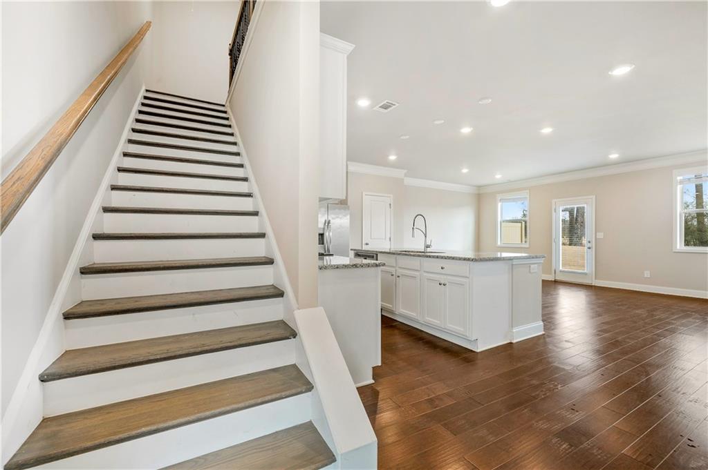 2747 Pearl Rdg Trace Buford, GA 30519 - Photo 4 of 41 a view of kitchen with wooden floor and electronic appliances