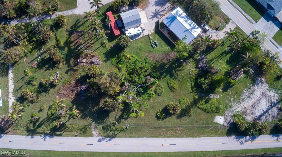15691 John Morris Road Fort Myers, FL 33908 - Photo 11 of 25 an aerial view of a house with a yard