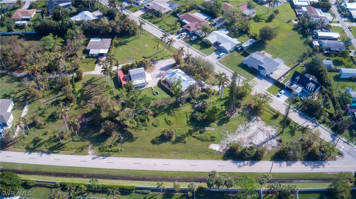 15691 John Morris Road Fort Myers, FL 33908 - Photo 13 of 25 an aerial view of a house with a yard