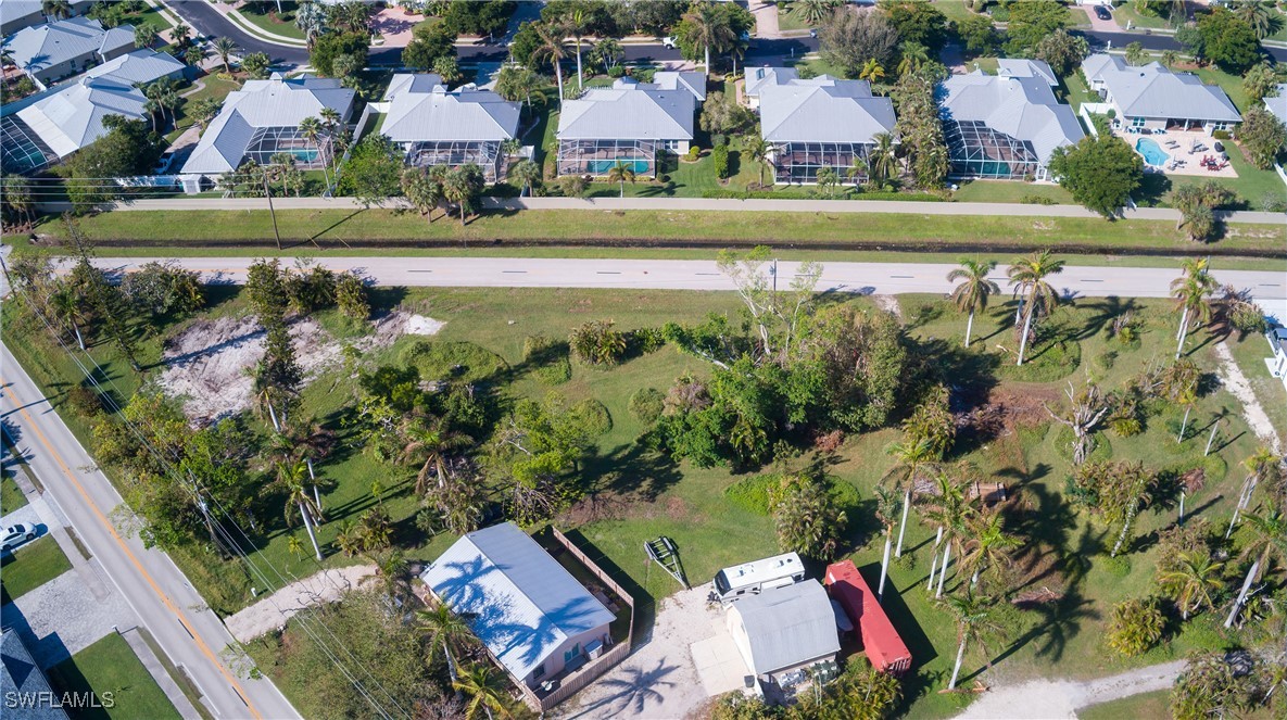 15691 John Morris Road Fort Myers, FL 33908 - Photo 10 of 25 an aerial view of residential houses with outdoor space and lake view