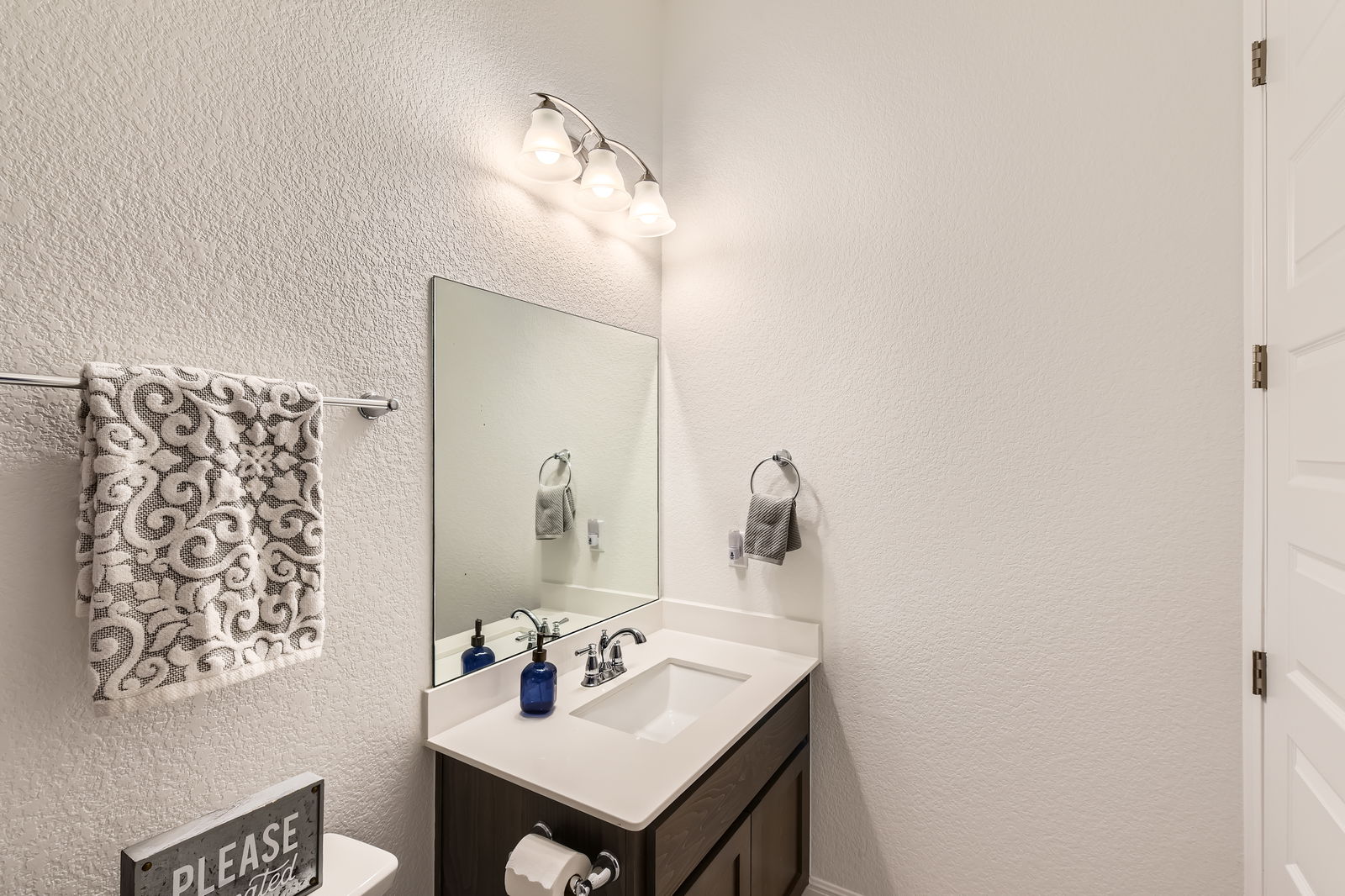 1332 Modoc Way Kyle, TX 78640 - Photo 22 of 28 a bathroom with a sink and a mirror