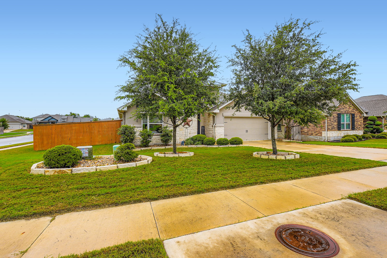 1332 Modoc Way Kyle, TX 78640 - Photo 3 of 28 a front view of a house with garden