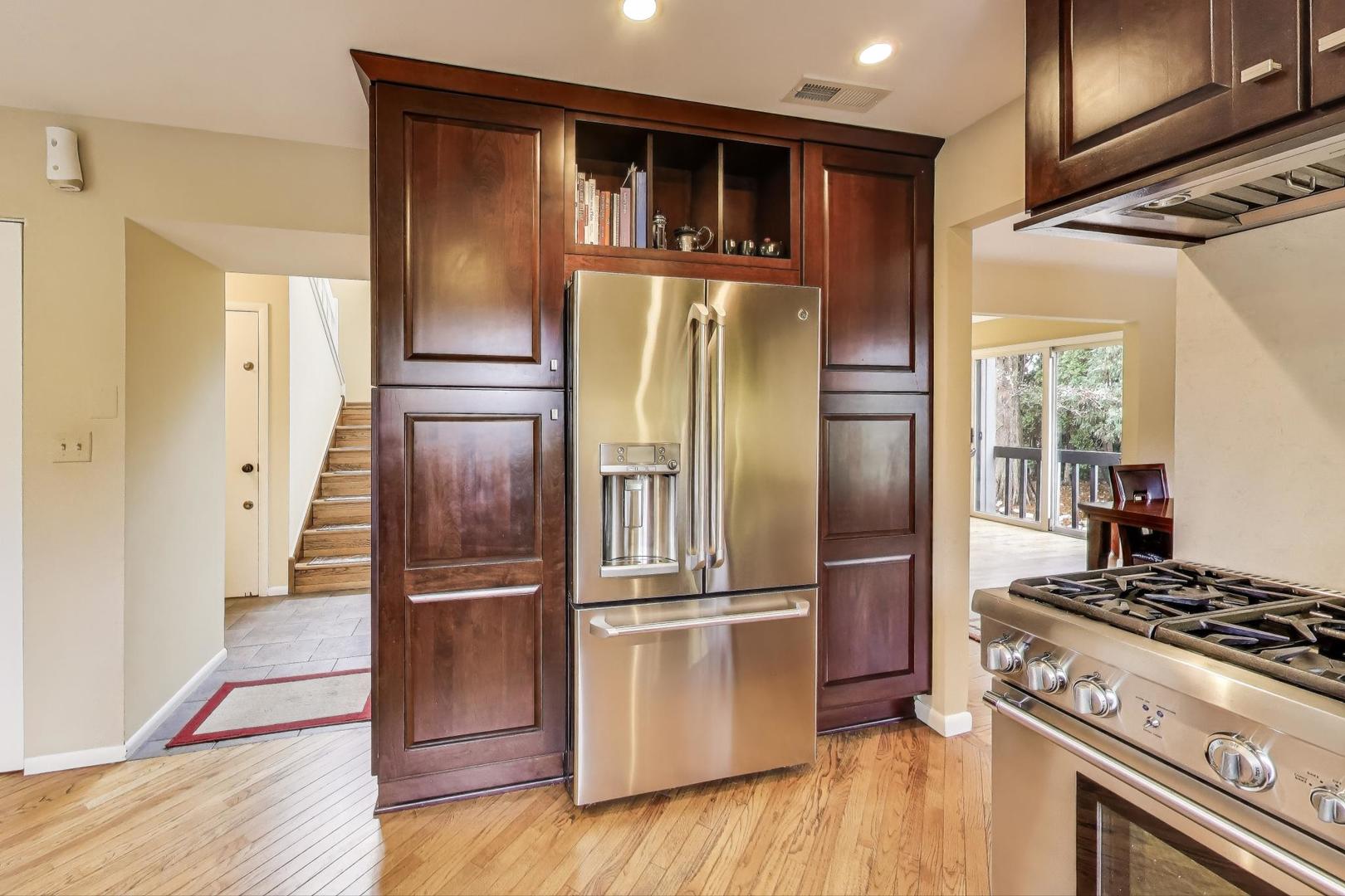 11515 Burr Oak Lane Burr Ridge, IL 60527 - Photo 13 of 73 a kitchen with stainless steel appliances granite countertop a refrigerator and a stove
