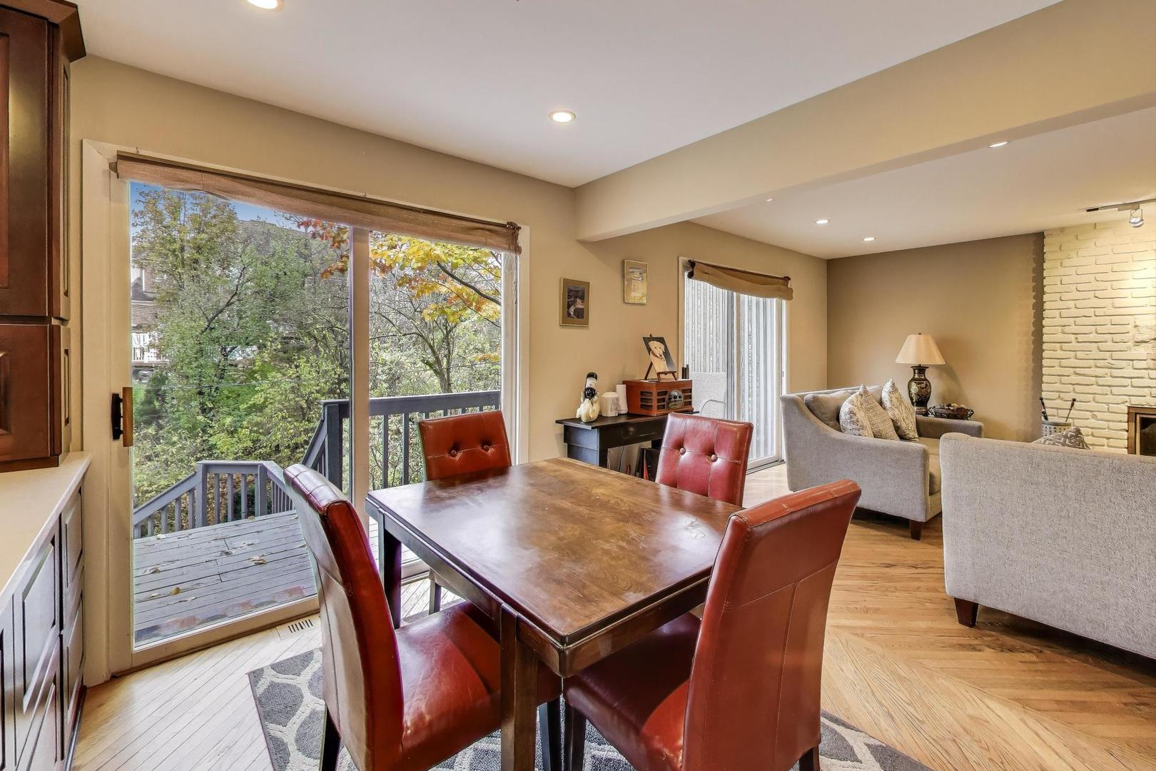 11515 Burr Oak Lane Burr Ridge, IL 60527 - Photo 16 of 73 a view of a dining room with furniture window and wooden floor