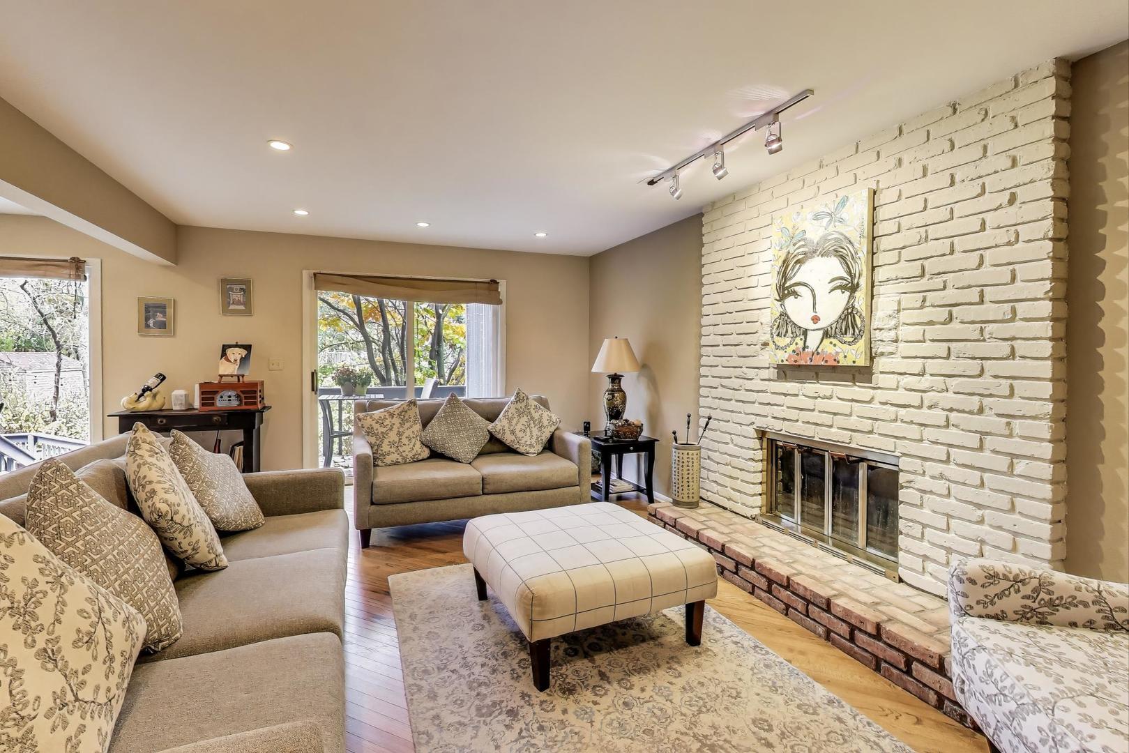 11515 Burr Oak Lane Burr Ridge, IL 60527 - Photo 19 of 73 a living room with furniture and a fireplace