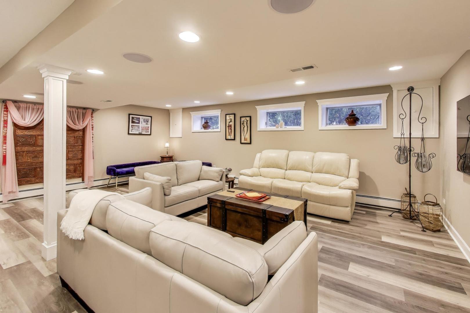 11515 Burr Oak Lane Burr Ridge, IL 60527 - Photo 36 of 73 a living room with furniture and a table