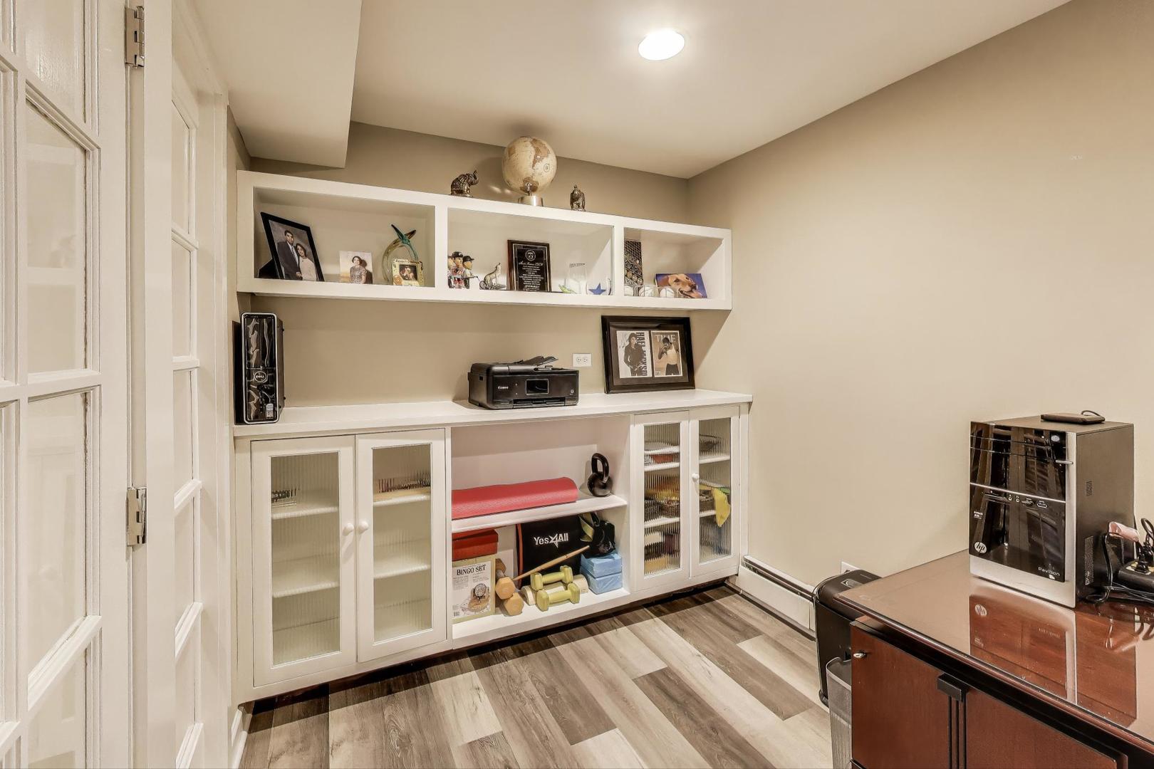 11515 Burr Oak Lane Burr Ridge, IL 60527 - Photo 43 of 73 a view of workspace with furniture and book shelf