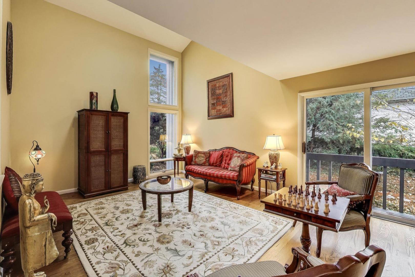11515 Burr Oak Lane Burr Ridge, IL 60527 - Photo 5 of 73 a living room with furniture and a rug