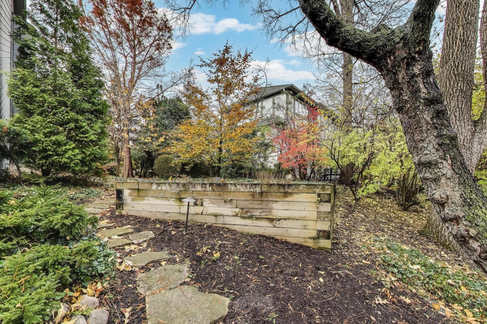 11515 Burr Oak Lane Burr Ridge, IL 60527 - Photo 56 of 73 a view of a bench in a yard