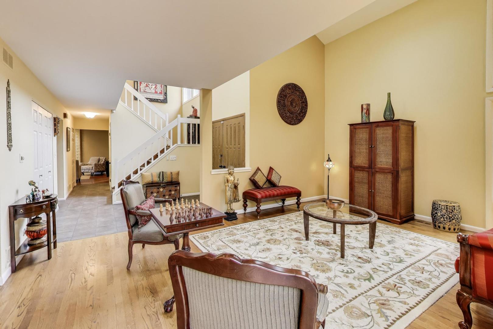 11515 Burr Oak Lane Burr Ridge, IL 60527 - Photo 6 of 73 a living room with furniture and a table