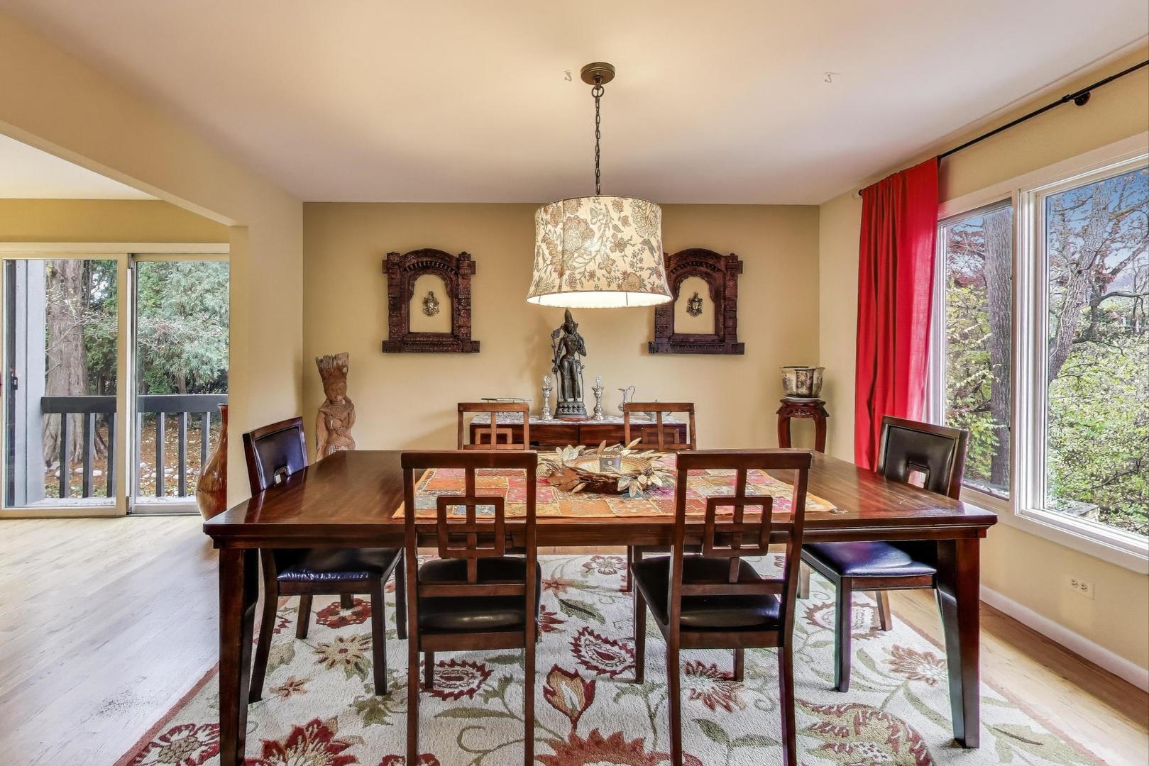 11515 Burr Oak Lane Burr Ridge, IL 60527 - Photo 9 of 73 a view of a dining room with furniture window and outside view