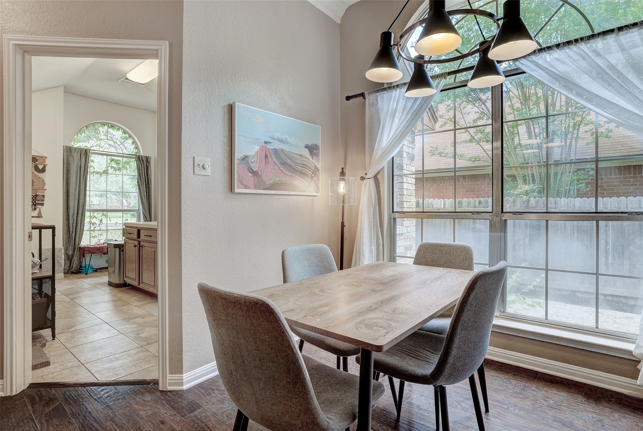 5907 Shanghai Pierce Road Austin, TX 78749 - Photo 7 of 29 Dining space with a textured wall and wood finished floors