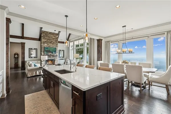 a large kitchen with a table and chairs