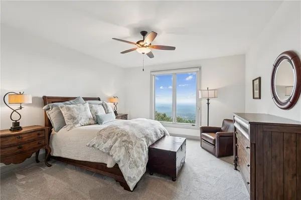 a view of a house with swimming pool and a yard