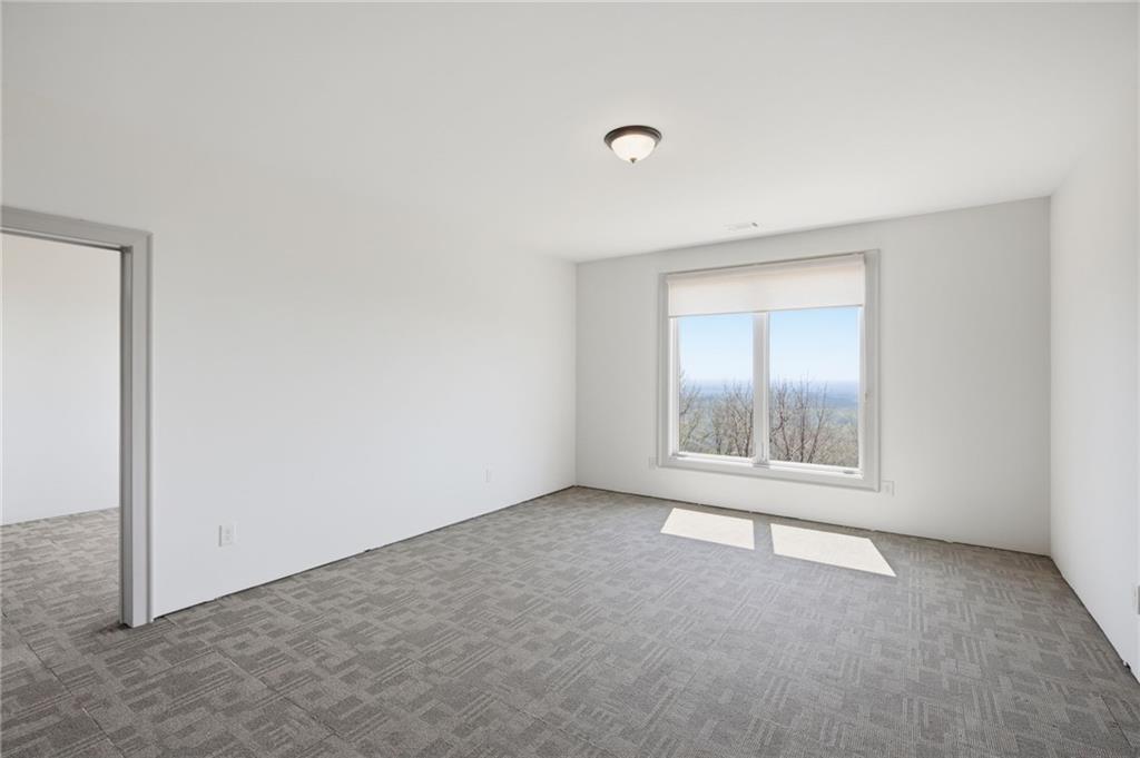 1455 Ridgeview Drive Big Canoe, GA 30143 - Photo 54 of 97 an empty room with windows