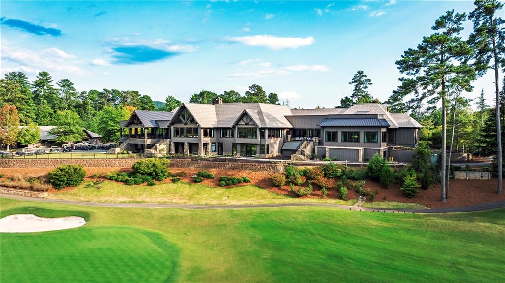1455 Ridgeview Drive Big Canoe, GA 30143 - Photo 80 of 97 a view of a house with swimming pool and a yard