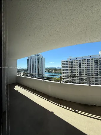 a view of balcony with furniture