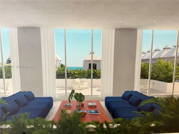 a living room with furniture potted plant next to a window