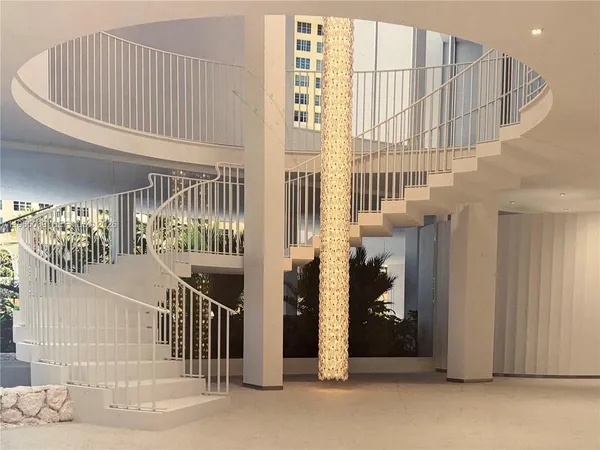 a bedroom with a bed and a chair