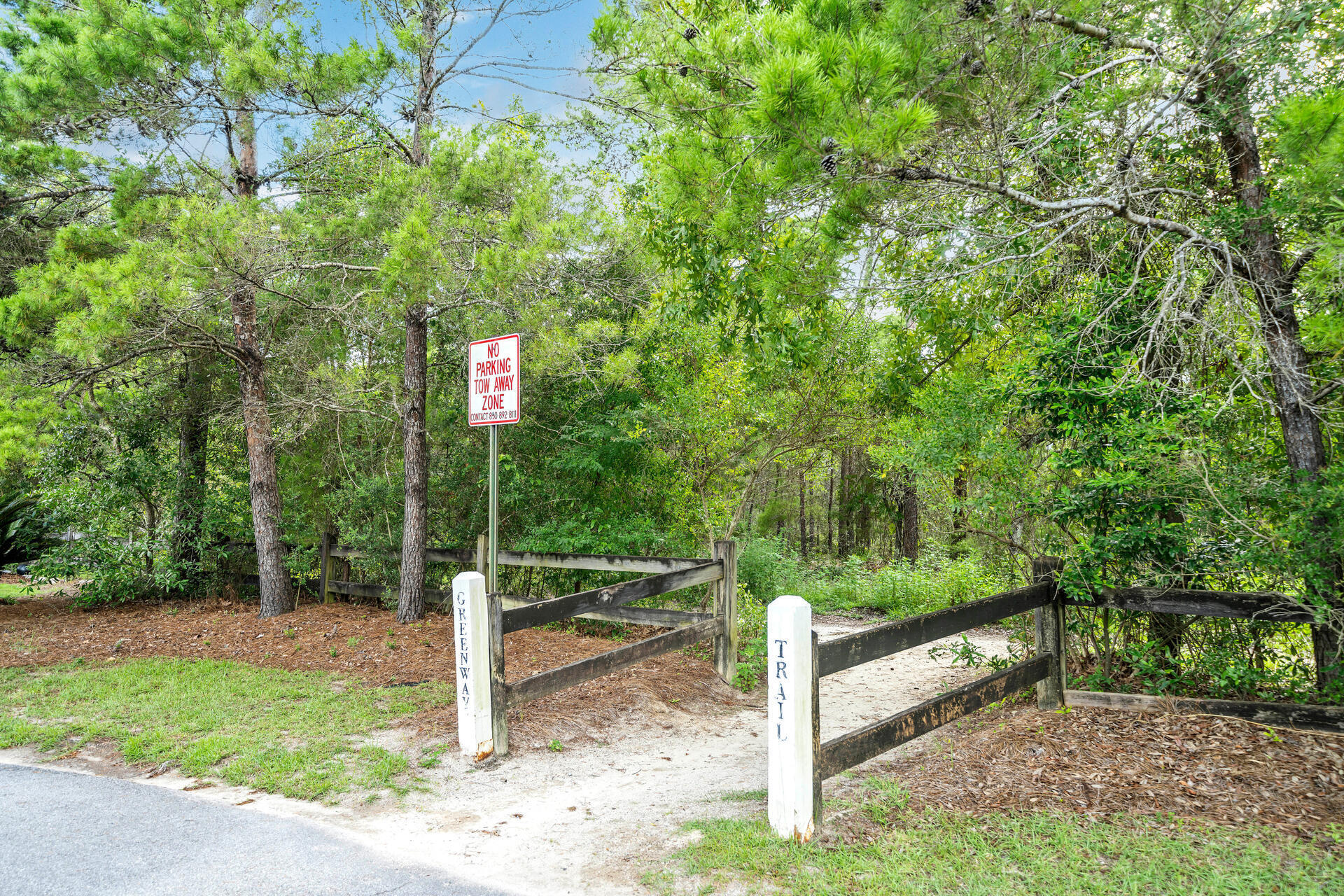 204 Vía Largo, Unit 29B Santa Rosa Beach, FL 32459 - Photo 36 of 40 a sign that is sitting in front of a tree
