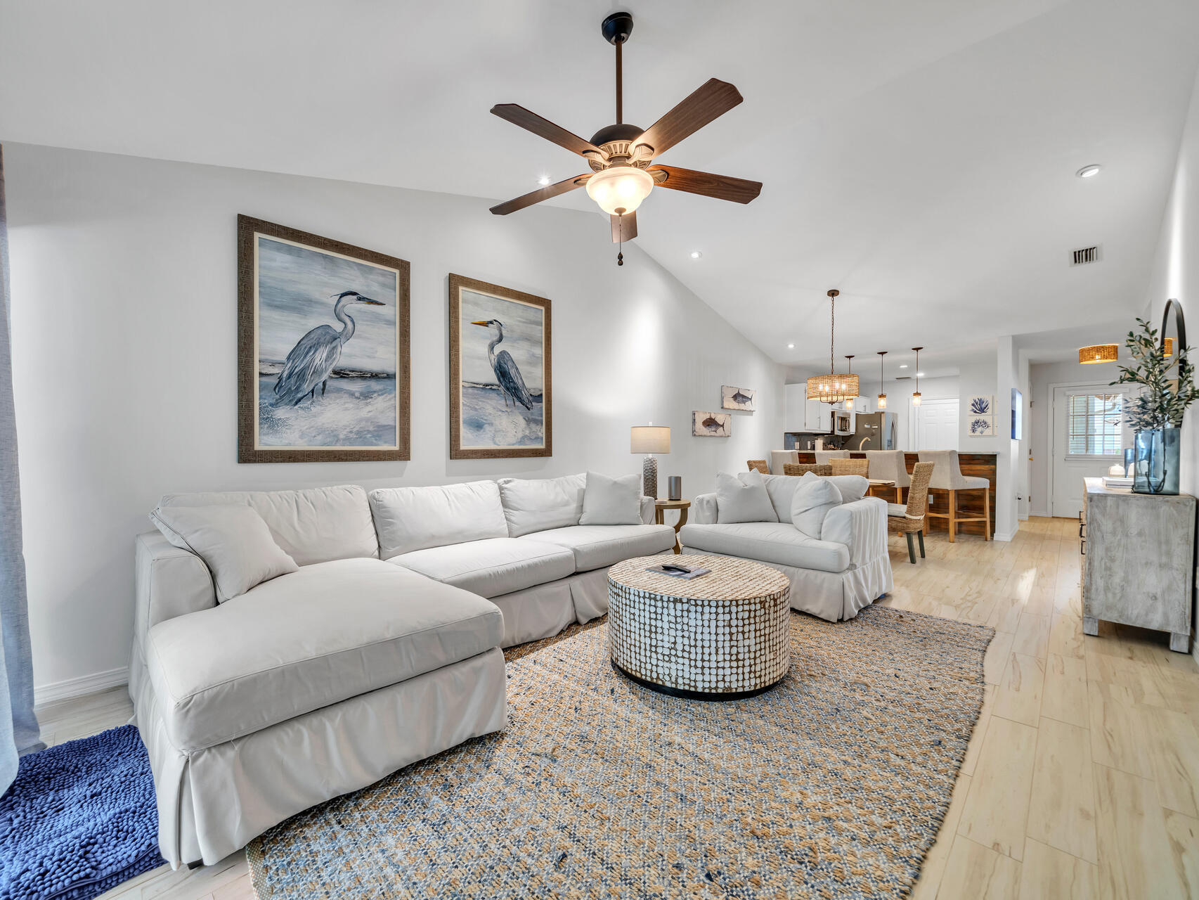 204 Vía Largo, Unit 29B Santa Rosa Beach, FL 32459 - Photo 8 of 40 a living room with couches and a view of kitchen