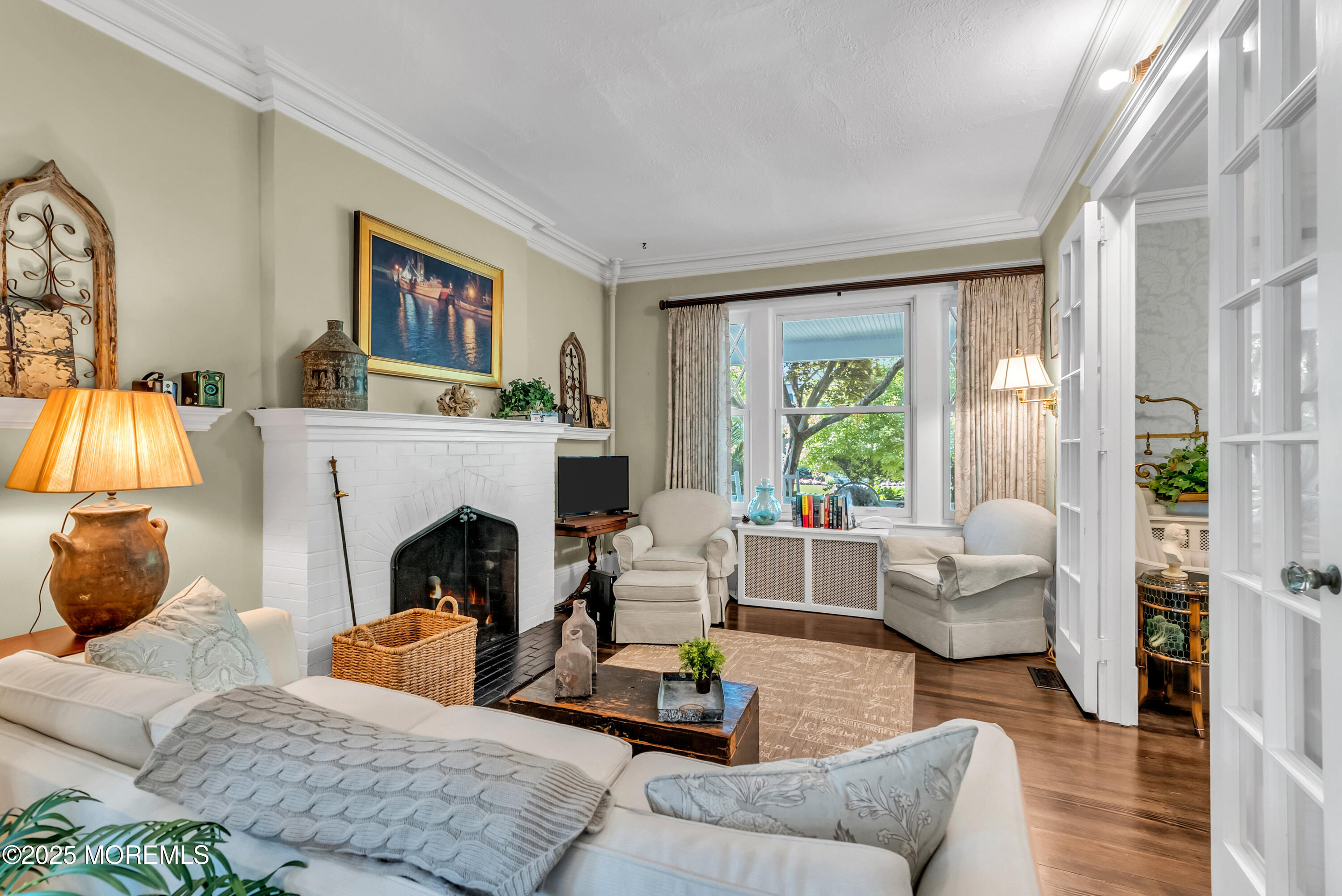 202 Ludlow Avenue Spring Lake, NJ 07762 - Photo 21 of 99 a living room with furniture and a fireplace