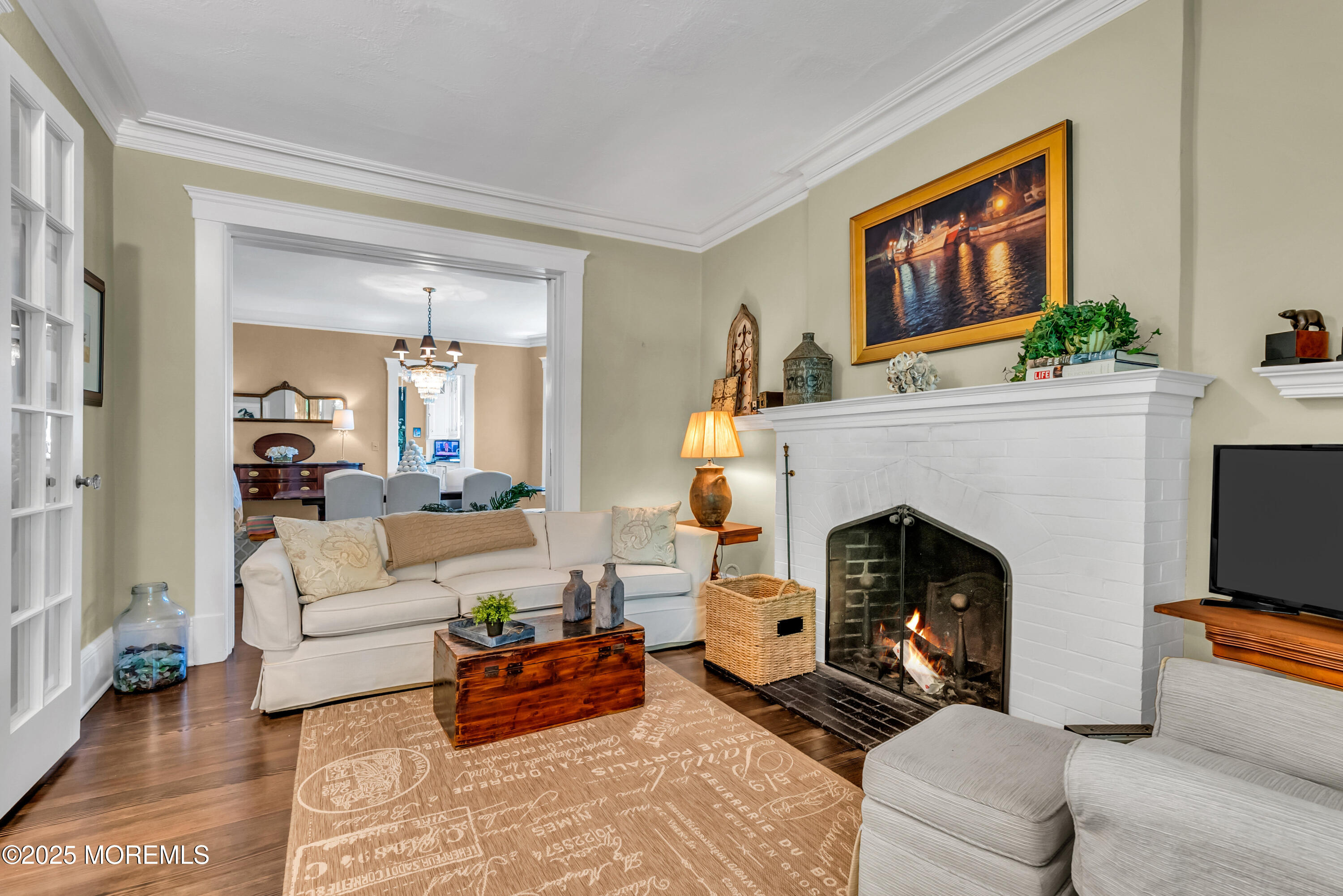 202 Ludlow Avenue Spring Lake, NJ 07762 - Photo 22 of 99 a living room with furniture and a fireplace