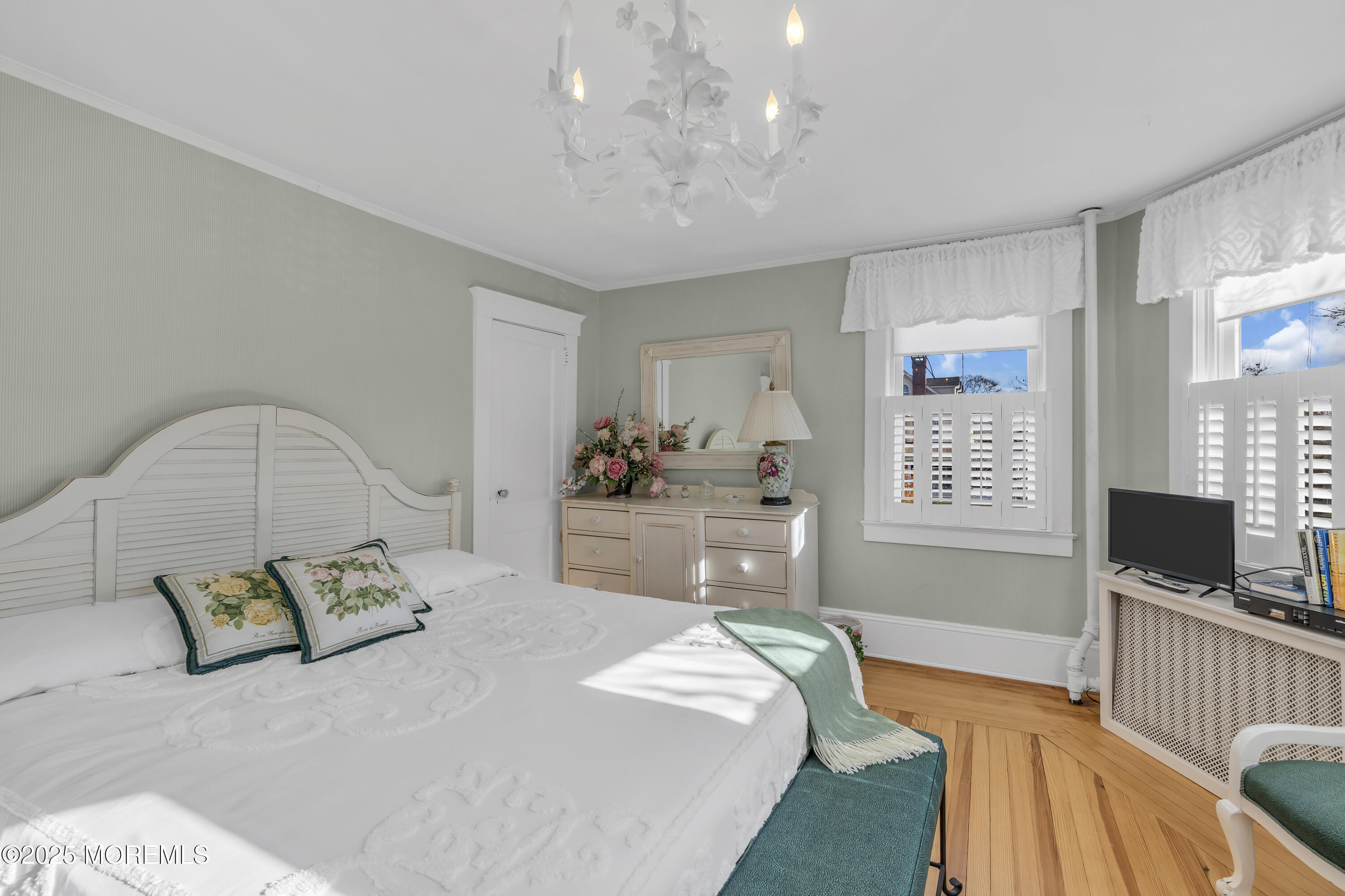 202 Ludlow Avenue Spring Lake, NJ 07762 - Photo 47 of 99 a spacious bedroom with a bed and flat screen tv