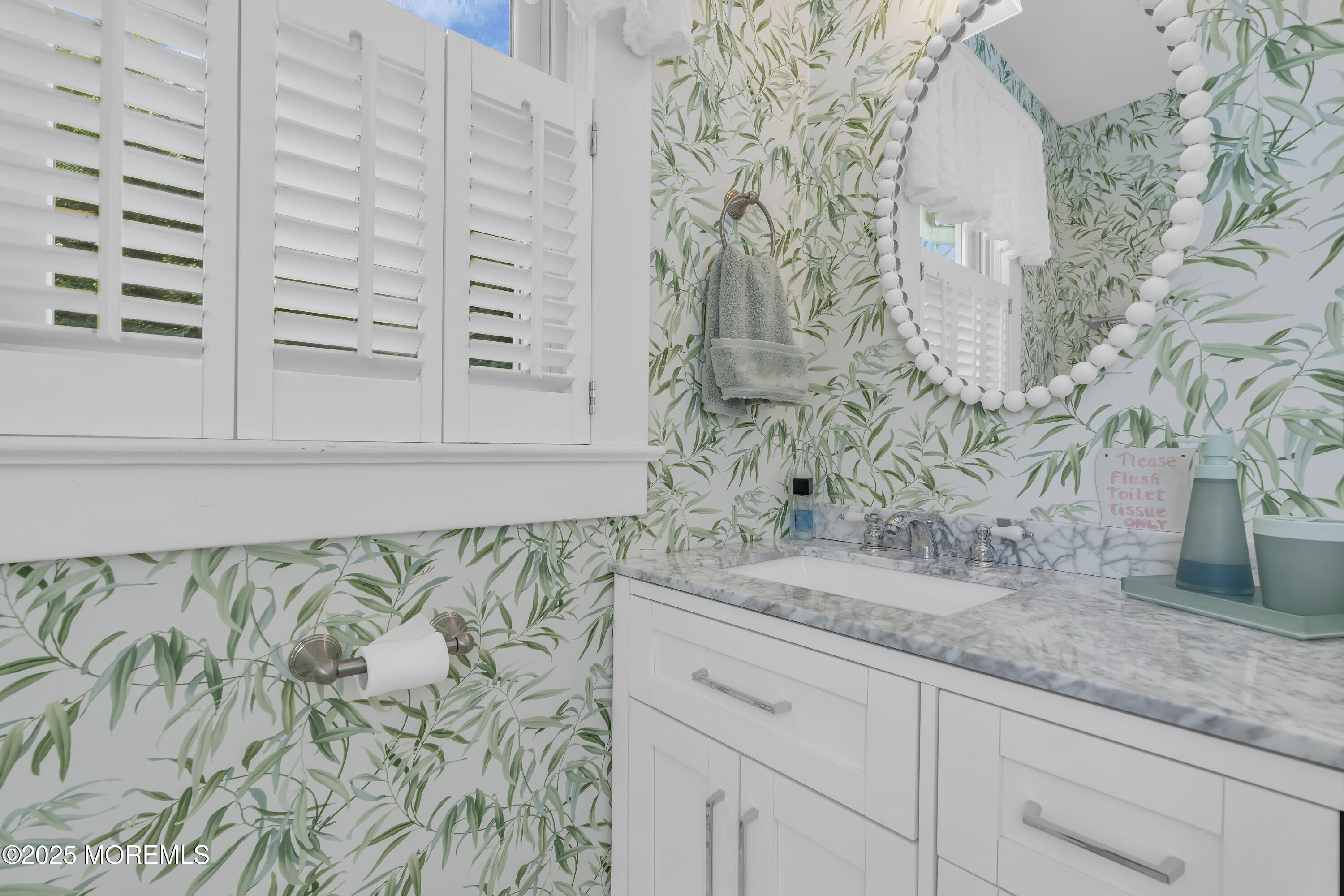 202 Ludlow Avenue Spring Lake, NJ 07762 - Photo 50 of 99 a bathroom with a granite countertop sink and a granite countertop