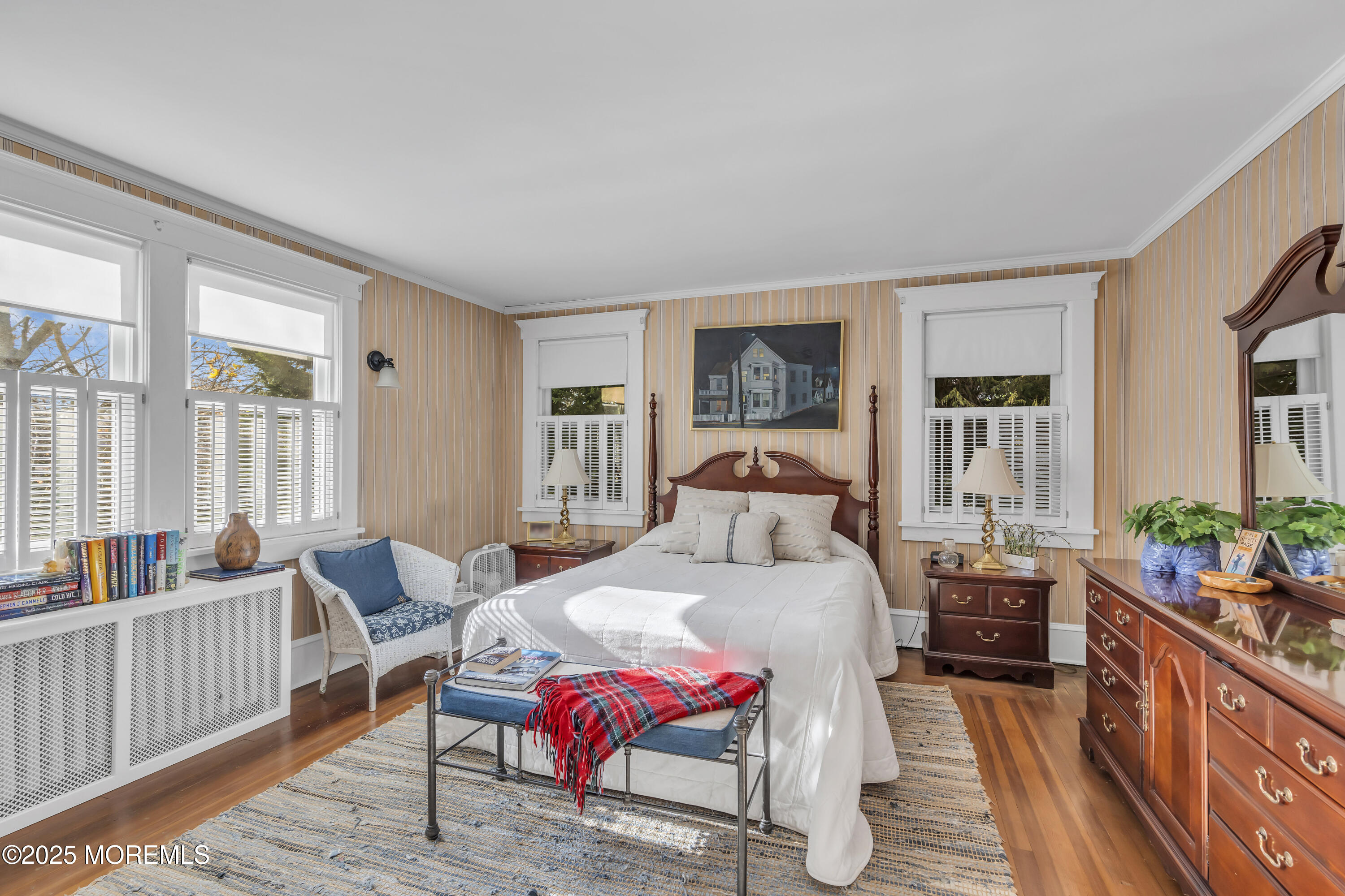 202 Ludlow Avenue Spring Lake, NJ 07762 - Photo 61 of 99 a bedroom with furniture and a wooden floor