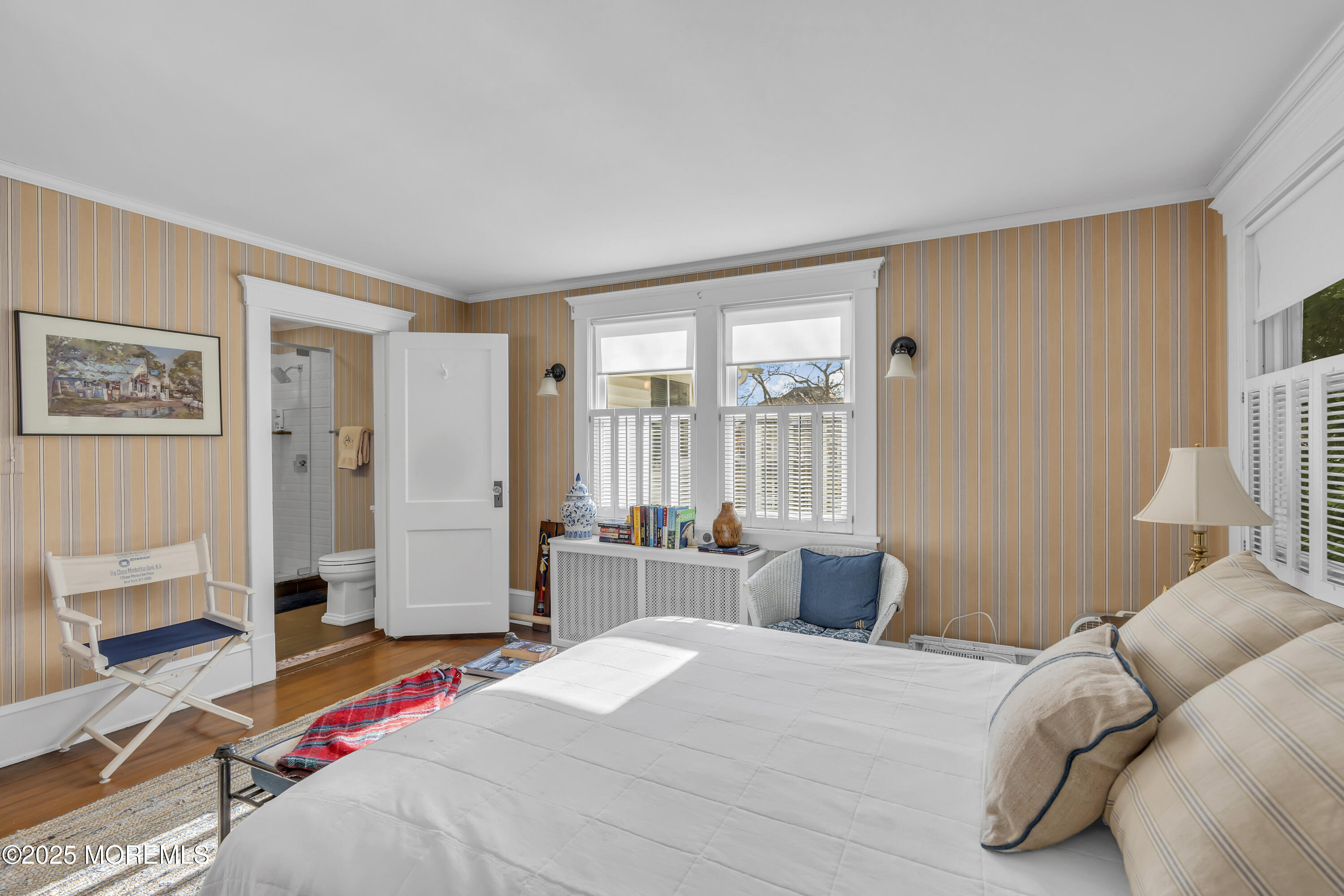 202 Ludlow Avenue Spring Lake, NJ 07762 - Photo 62 of 99 a bedroom with a bed and wooden floor