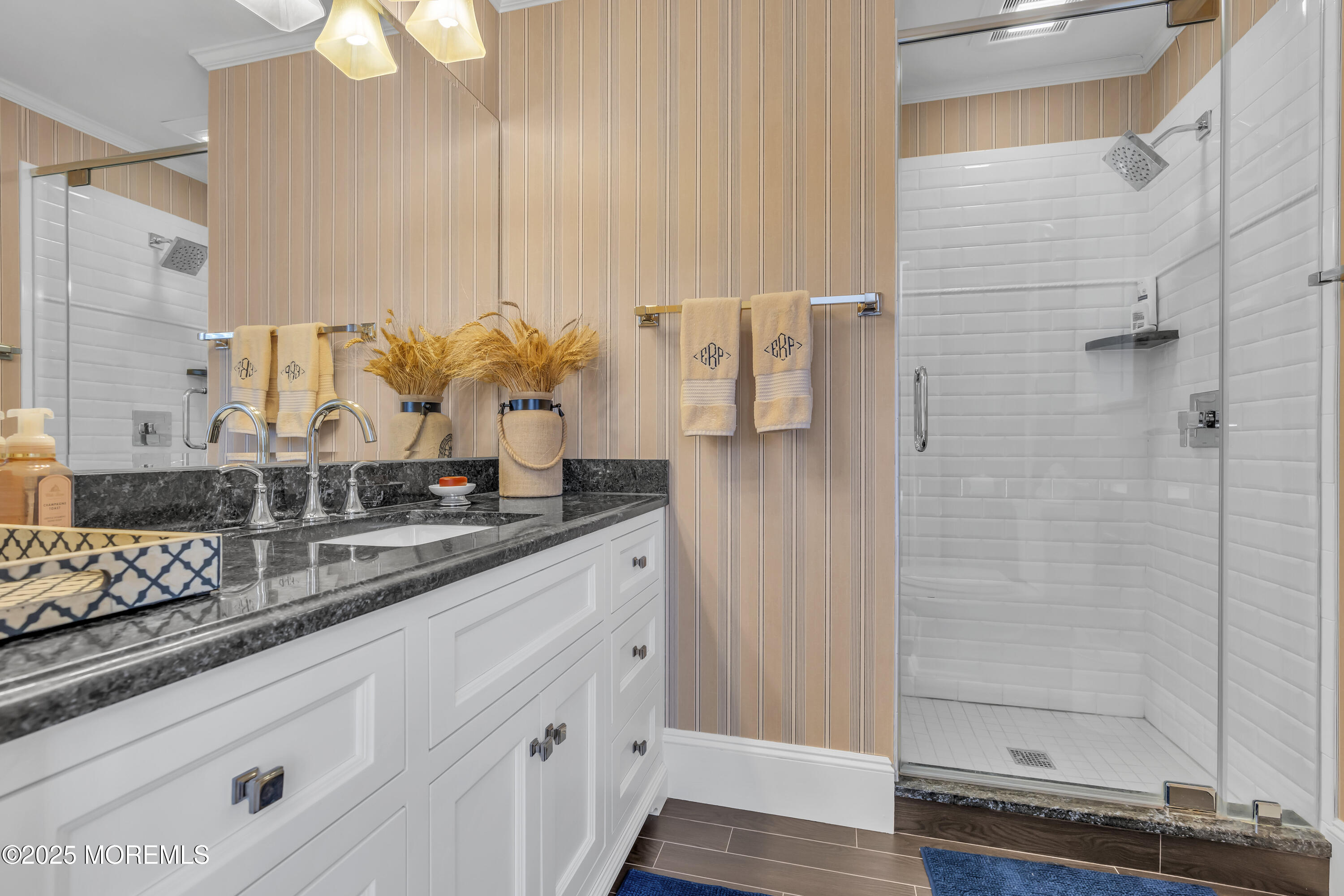202 Ludlow Avenue Spring Lake, NJ 07762 - Photo 64 of 99 a bathroom with a granite countertop sink a mirror and shower