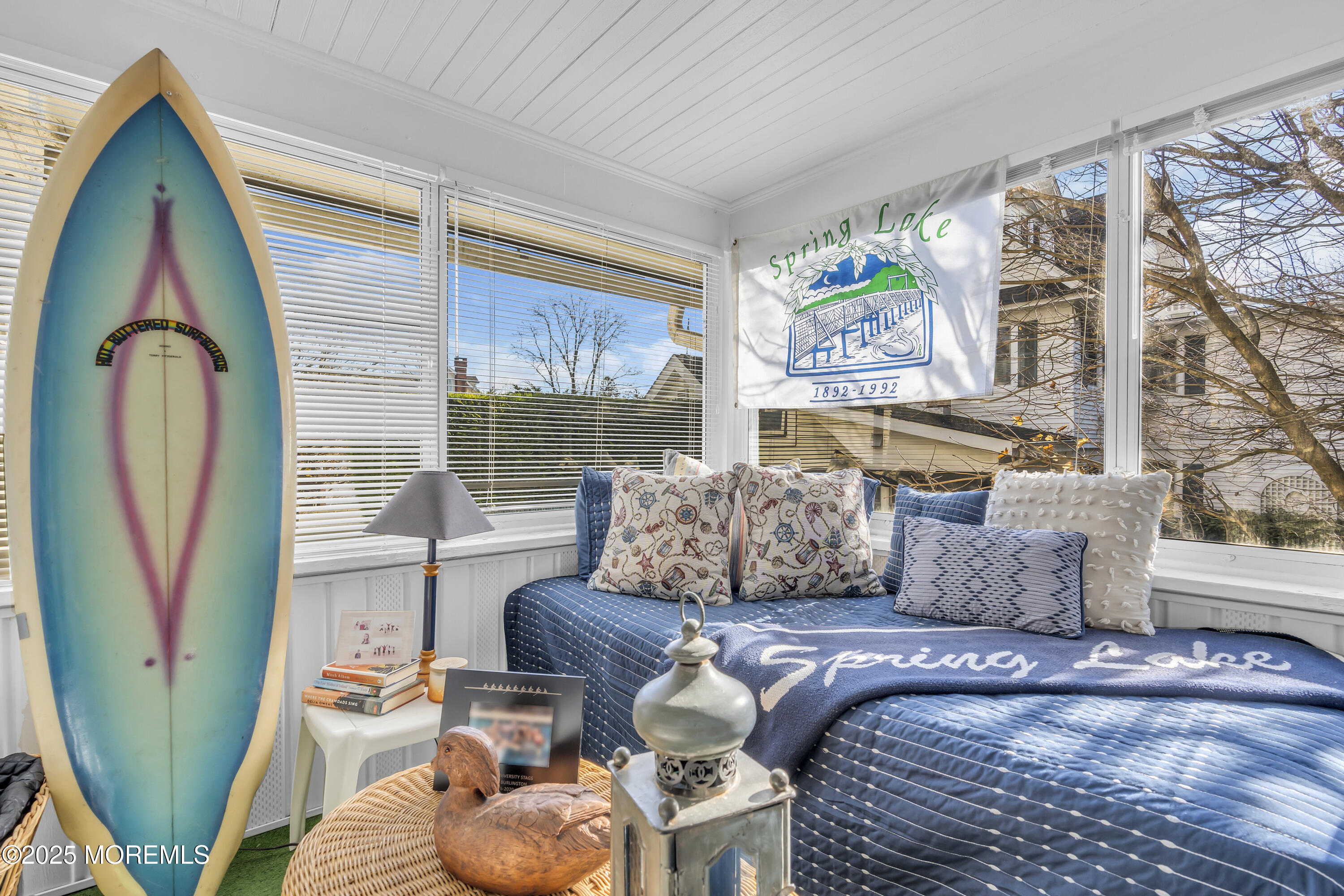 202 Ludlow Avenue Spring Lake, NJ 07762 - Photo 84 of 99 a living room with furniture a fireplace and a large window