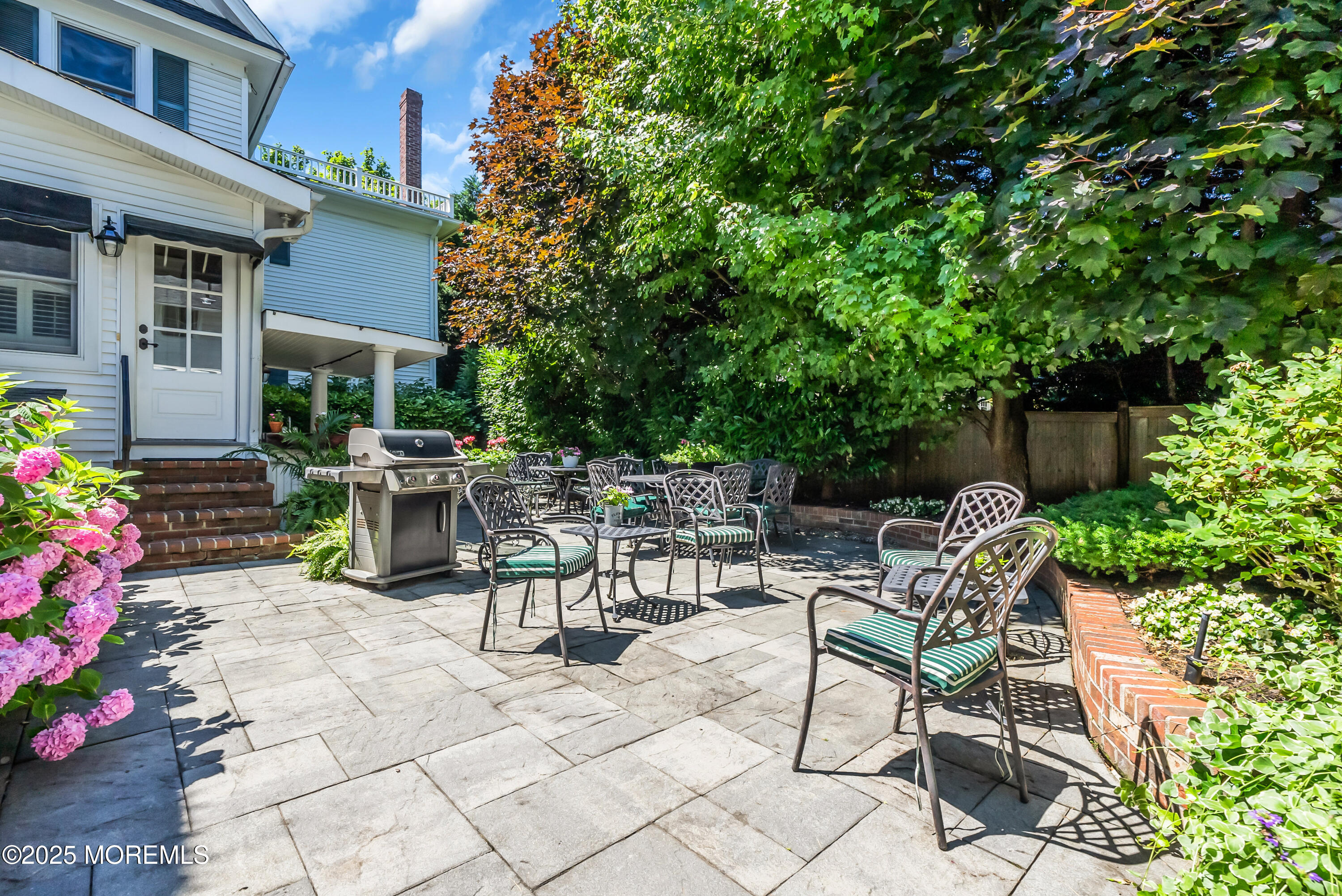202 Ludlow Avenue Spring Lake, NJ 07762 - Photo 88 of 99 a view of backyard with outdoor seating and plants