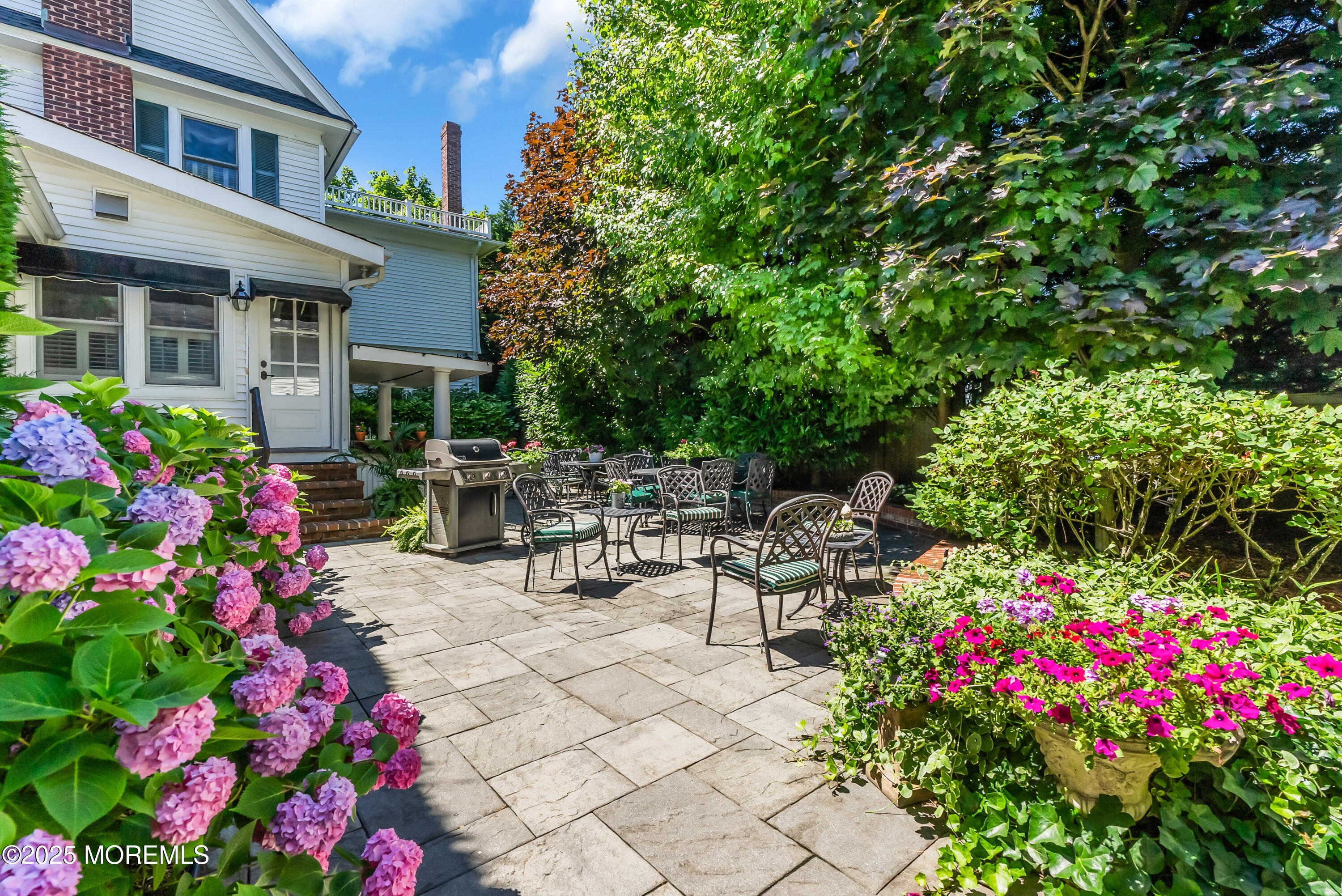 202 Ludlow Avenue Spring Lake, NJ 07762 - Photo 91 of 99 a view of a patio with table and chairs and potted plants