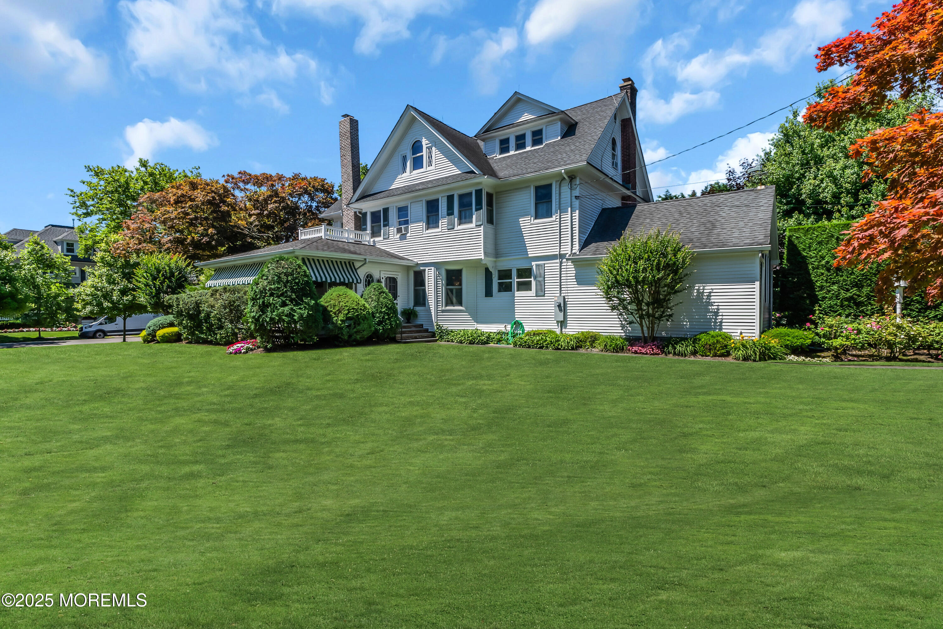 202 Ludlow Avenue Spring Lake, NJ 07762 - Photo 96 of 99 a front view of a house with a garden