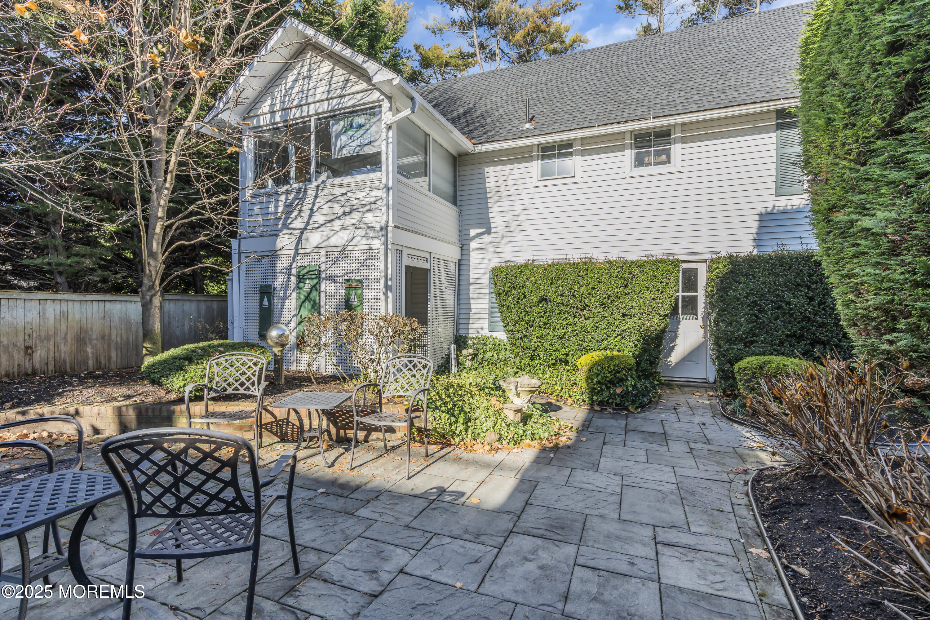 202 Ludlow Avenue Spring Lake, NJ 07762 - Photo 98 of 99 a view of a chairs and table in backyard of the house