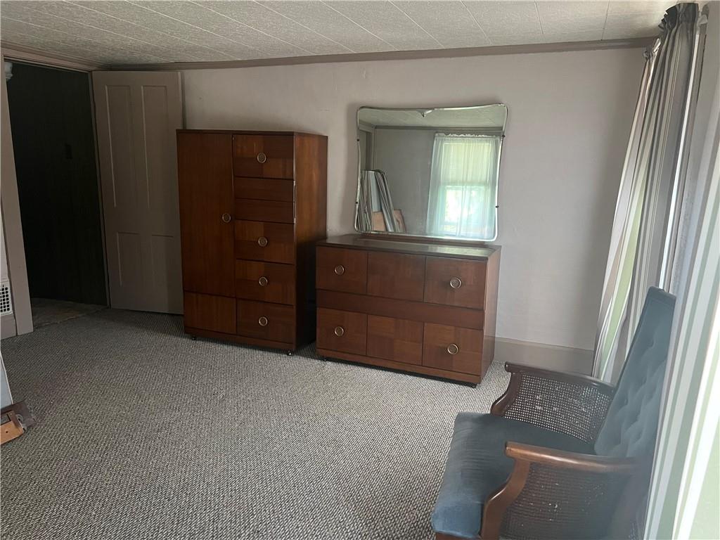 209-211 Old School Road Luxor, PA 15662 - Photo 11 of 27 an empty room with mirror and door